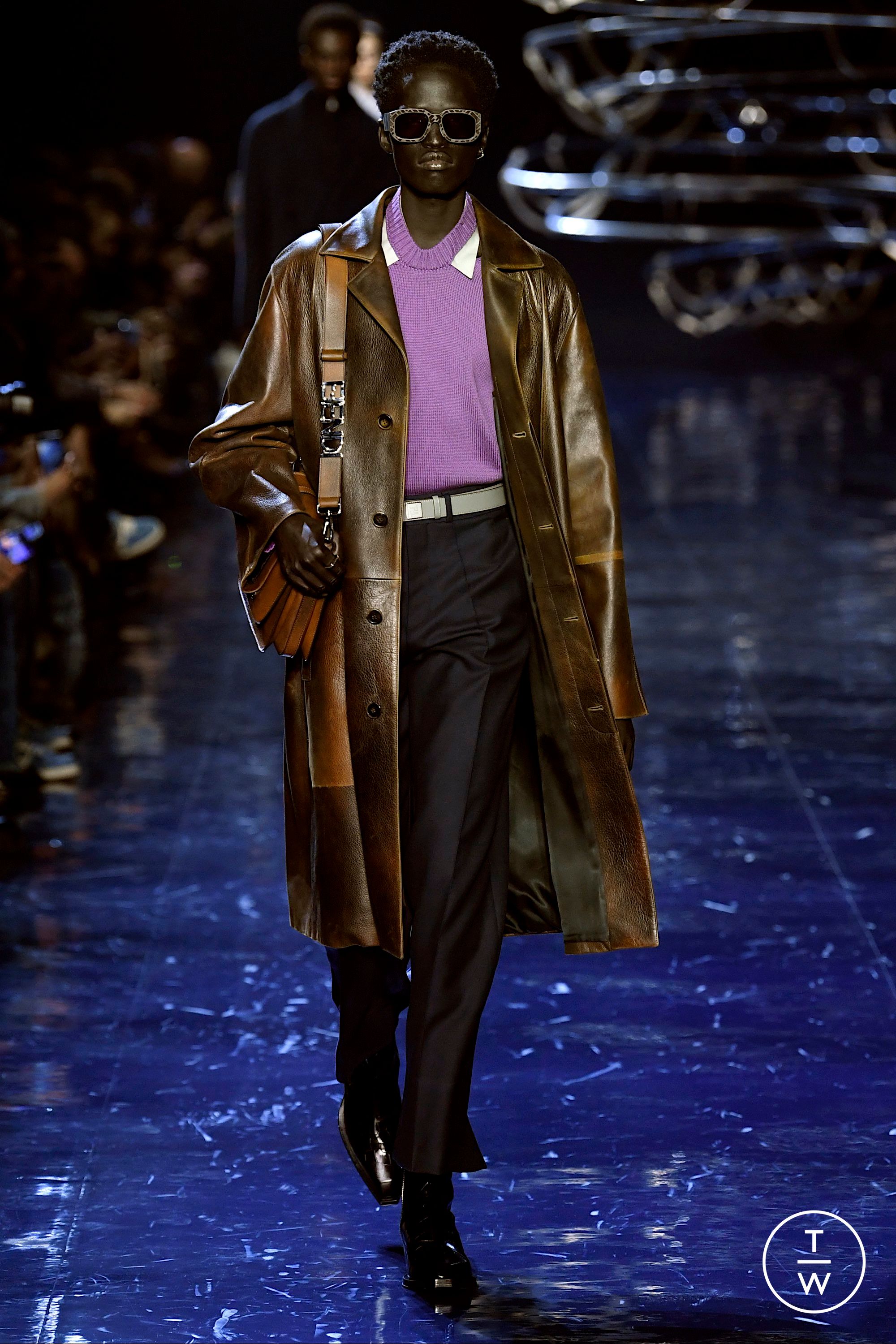 A model, sunglasses detail, walks the runway at the Fendi fashion