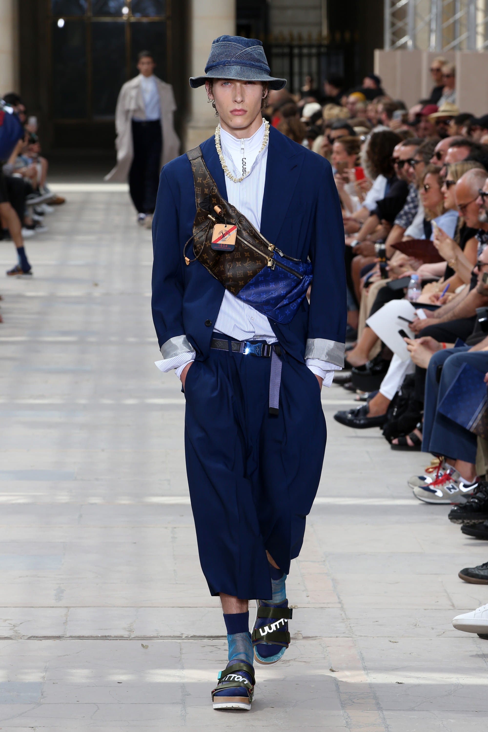 A model walks the runway during the Louis Vuitton Menswear Spring/Summer  2018 show as part